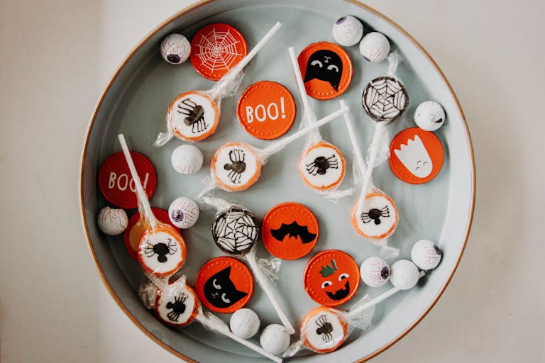 A vibrant assortment of Halloween-themed candies in a bowl, perfect for seasonal celebrations.